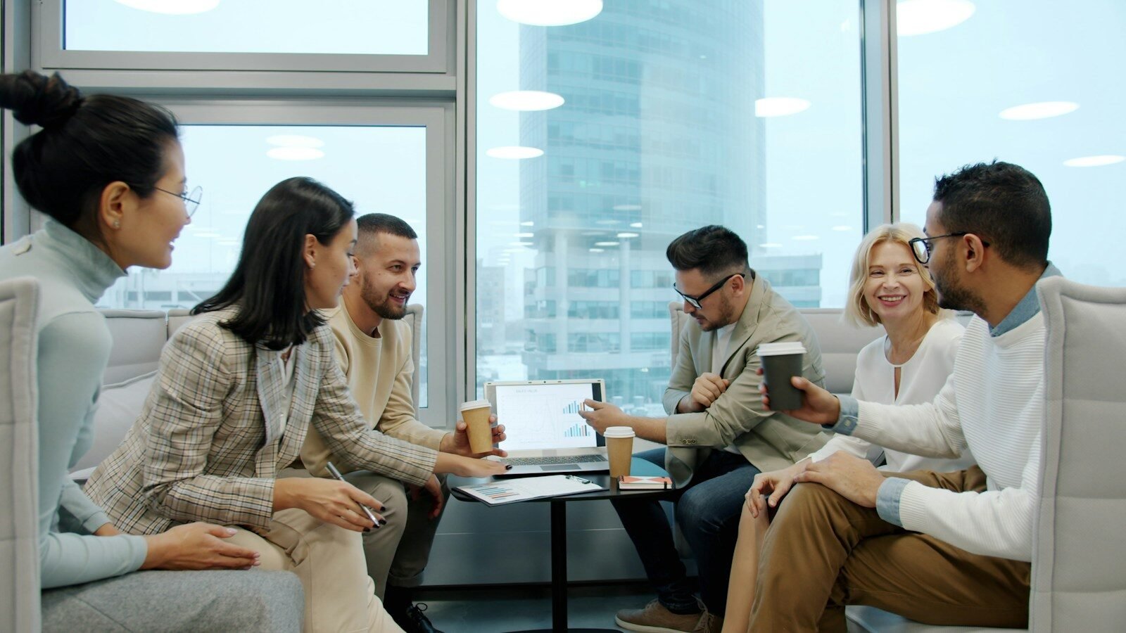 Diverse group of people in a modern office meeting